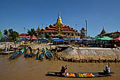 Inle Lake Myanmar. Phaung Daw Oo Paya. Enshrined in the pagoda are five small ancient Buddha images that have been transformed into amorphous blobs by the sheer volume of gold leaf applied by devotees.  